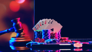 playing cards and casino chips on top of a laptop with a symbol of justice